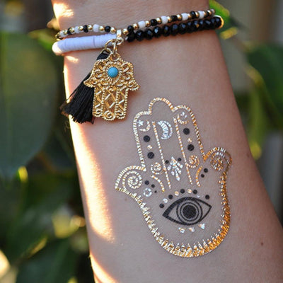 Small Tribal Wrist  Hamsa Tattoo Ideas for Women at MyBodiArt.com - Boho Gold Metallic Hand Tat with Evil Eye