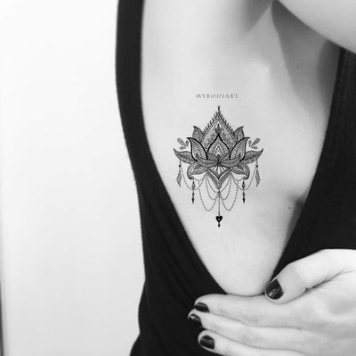 Beautiful Linework Black Henna Lotus Chandelier Boho Rib Tattoo Ideas for Women - www.MyBodiArt.com #tattoos