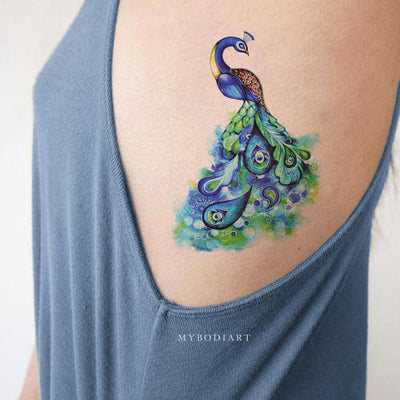 Beautiful Watercolor Bird Peacock Art Design Rib Tattoo Ideas for Women -  ideas de tatuaje de costilla de pavo real para mujeres - www.MyBodiArt.com #tattoos