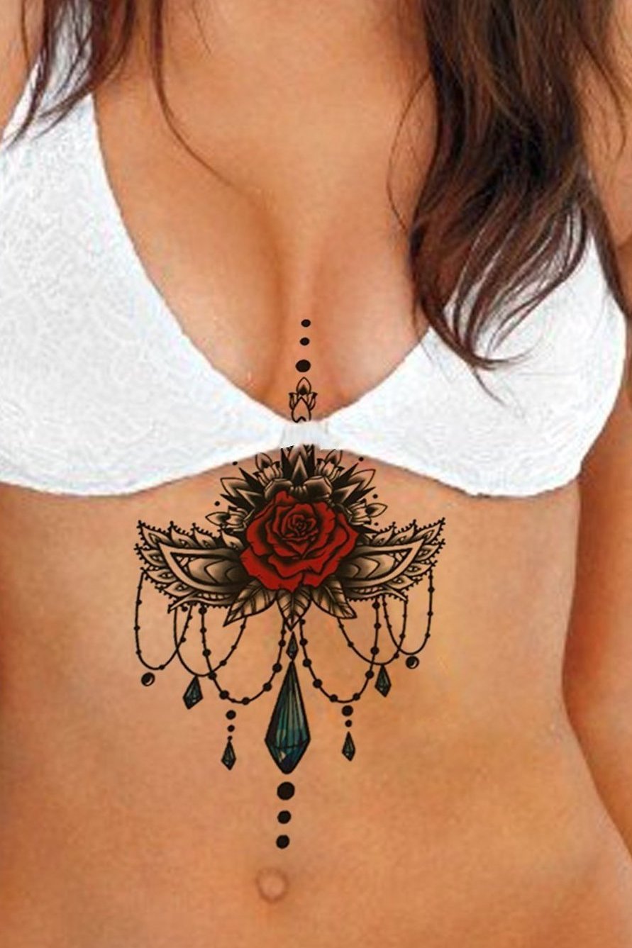 Line art rose tattoo on the sternum.
