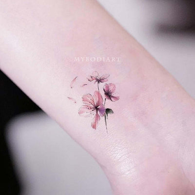 Cute Small Watercolor Floral Flower Cherry Blossom Wrist Tattoo Ideas for Women - www.MyBodiArt.com #tattoos